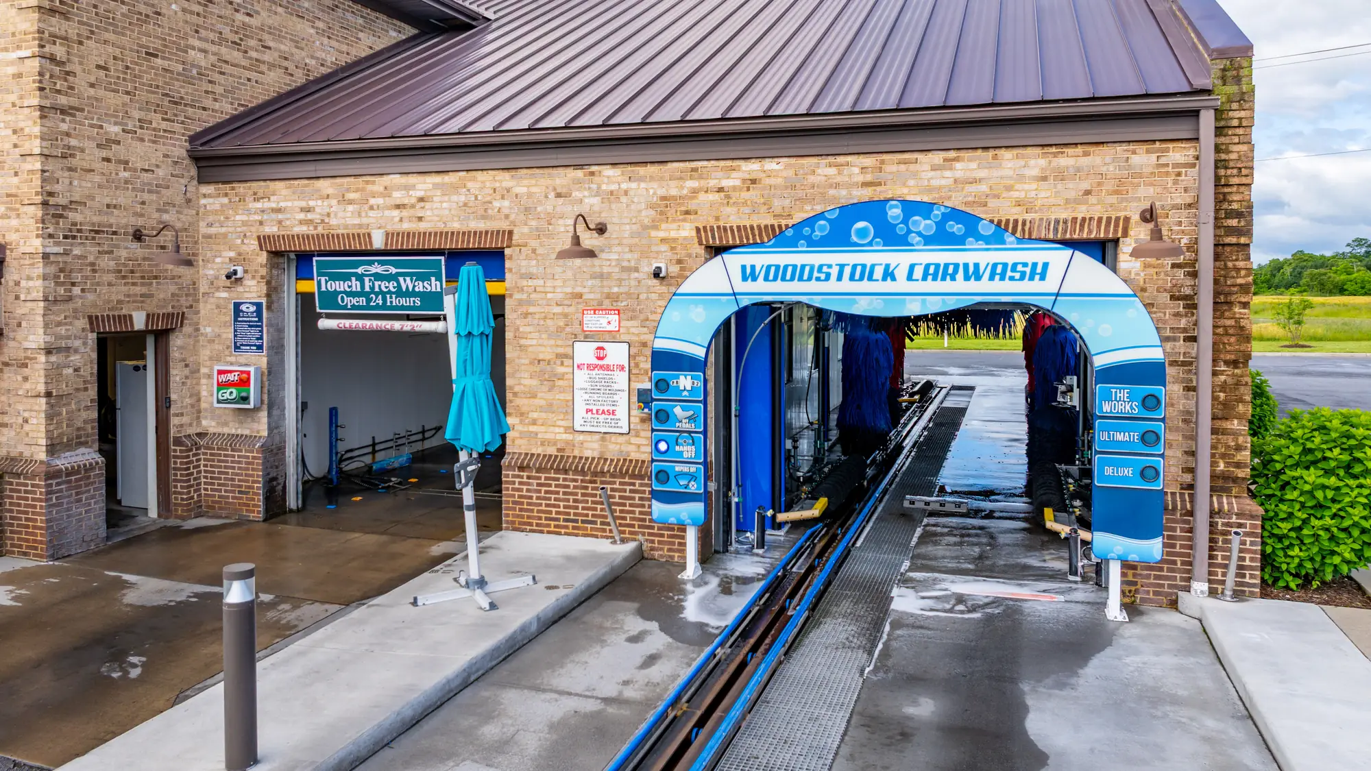 Entrance to the express wash tunnel with its brushes at Woodstock Car Wash in Woodstock, Virginia